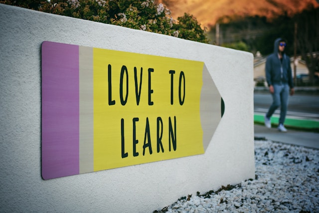 Office wall with the words " love to learn" written across.